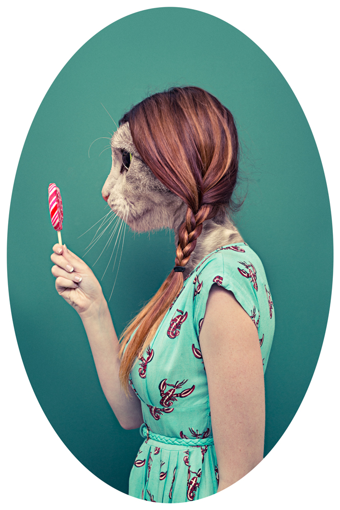 Girl in summer dress holding a lollypop with a cat as a head